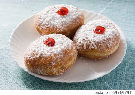 Hanukkah sufganiyot. Traditional Jewish donuts for Hanukkah.	 69569791