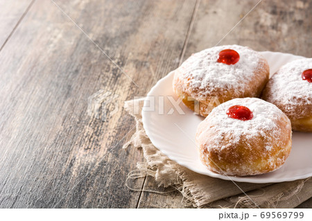 Hanukkah sufganiyot. Traditional Jewish donuts for Hanukkah.	 69569799