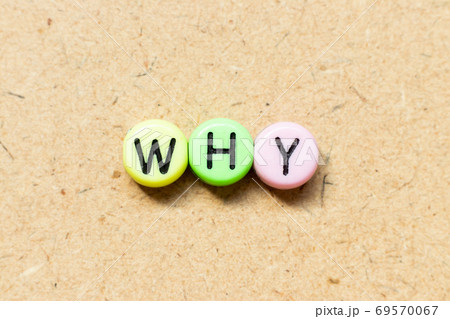 Round color bead with black letter in word why on wood background 69570067