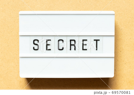 Lightbox with word secret on wood background Lightbox with word secret on wood background 69570081