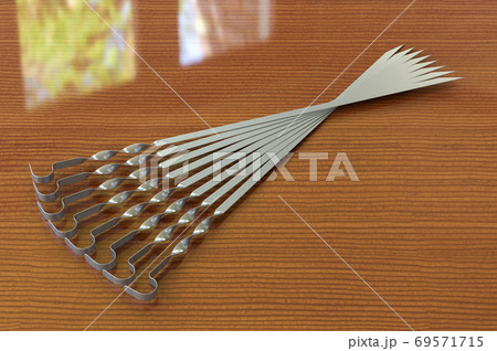 Set of skewers on the wooden table. 3D rendering Set of skewers on the wooden table. 3D rendering 69571715