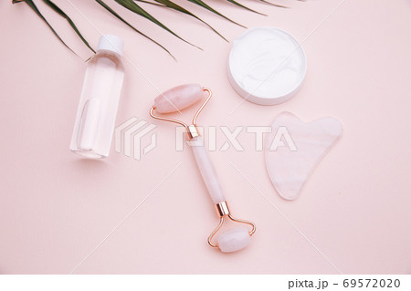 Selfcare, relaxation and beauty care concept. Modern apothecary or home spa composition on pink background Selfcare, relaxation and beauty care concept. Modern apothecary or home spa composition on pink background 69572020