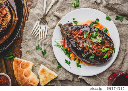 Eggplant stuffed with ground beef and tomatoes 69574312