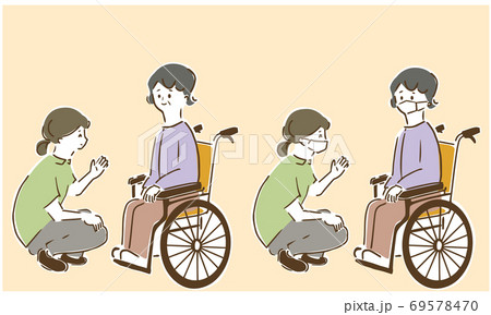 車椅子の女性と話をする（白囲み付き） 69578470