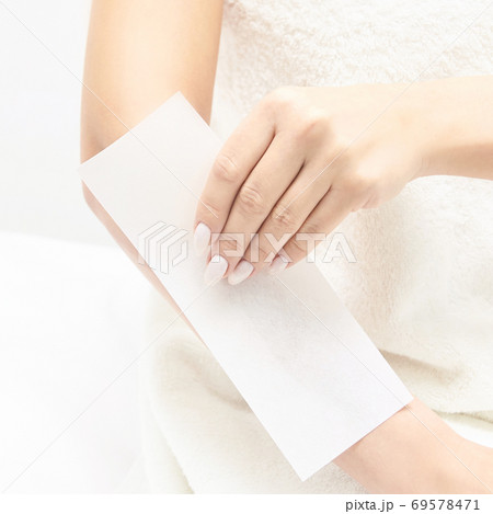 Unwanted hair wax epilation. Young Woman. cosmetology salon treatment procedure. Home waxing 69578471