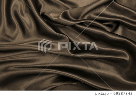 Smooth elegant brown silk or satin texture as abstract background. Luxurious background design. In Sepia toned. Retro style 69587342