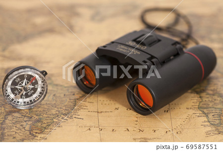 Binocular and compass on map Binocular and compass on map 69587551
