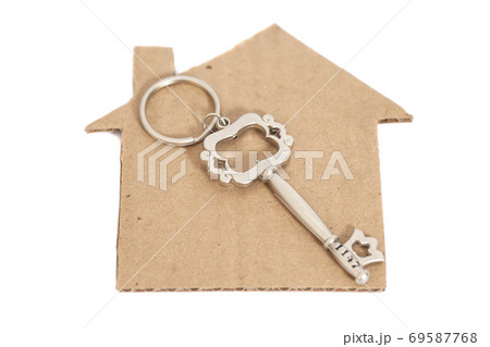 Paper house with key isolated on white 69587768