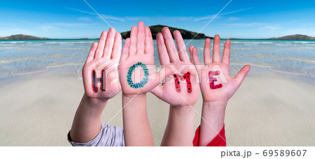 Children Hands Building Word Home, Ocean Background Children Hands Building Word Home, Ocean Background 69589607