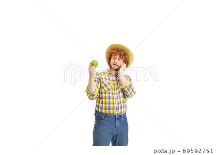 Handsome farmer, rancher isolated over white studio background Handsome farmer, rancher isolated over white studio background 69592751