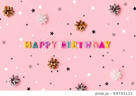 Happy birthday inscription from wooden colorful letters with confetti Happy birthday inscription from wooden colorful letters with confetti 69593121