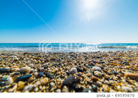 Sun shining over Perdepera beach 69595670