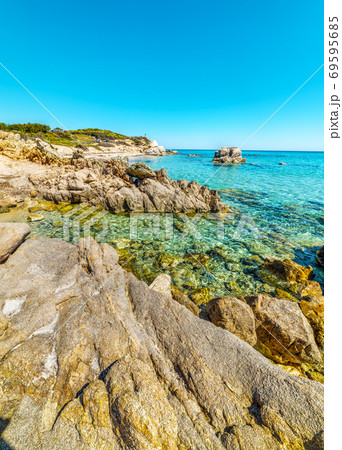 Rocky shore in Santa Giusta beach Rocky shore in Santa Giusta beach 69595685