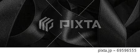 Black silk ribbon as background, abstract and luxury brand design Black silk ribbon as background, abstract and luxury brand design 69596555