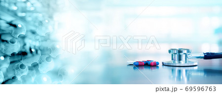 stethoscope with capsule drug and molecular chemistry structure in health science lab background stethoscope with capsule drug and molecular chemistry structure in health science lab background 69596763