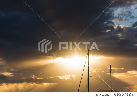 boat masts under a dark sky 69597135