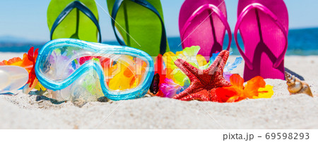 Scuba mask and colorful flip flops 69598293