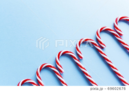 Christmas candy canes and fir branches flat lay Christmas candy canes and fir branches flat lay 69602676