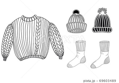 A set of warm winter clothes. Sweater, socks, hats A set of warm winter clothes. Sweater, socks, hats 69603489