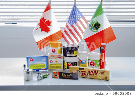 Calgary, Alberta, Canada. Sep 18, 2020. Canadian legal cannabis popular brands of marijuana weed plastic containers with USA, Mexico and Canada flag. Calgary, Alberta, Canada. Sep 18, 2020. Canadian legal cannabis popular brands of marijuana weed plastic containers with USA, Mexico and Canada flag. 69608008