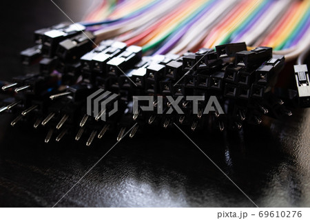 Multicolored computer wires on a black background Multicolored computer wires on a black background 69610276