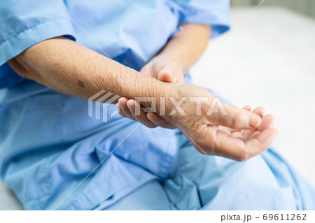 Asian senior woman patient pain arm and wrist. Asian senior woman patient pain arm and wrist. 69611262