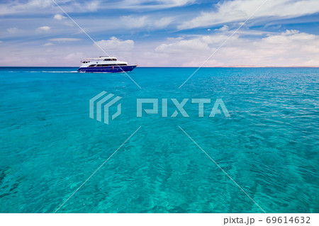 Cruise yacht bow in clear water near a coral reef. Red Sea, Egypt Cruise yacht bow in clear water near a coral reef. Red Sea, Egypt 69614632