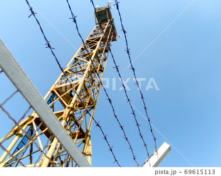 fence barbed wire and watchtower on the border of Ukraine fence barbed wire and watchtower on the border of Ukraine 69615113