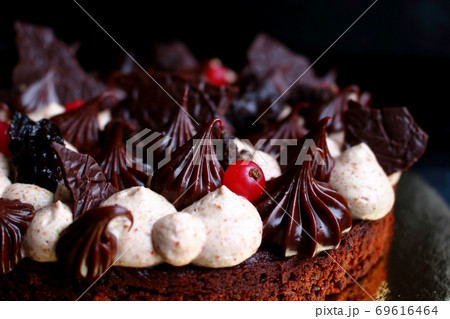 Chocolate brownie cake with coffee cream, ganache, prunes and red currants 69616464