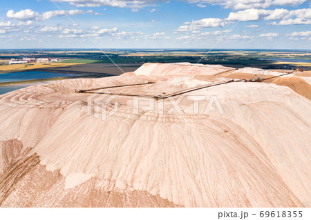 Mountains of products for the production of potash salt.Salt mountains near the city of Soligorsk.Production of fertilizer for the land. Belarus. 69618355