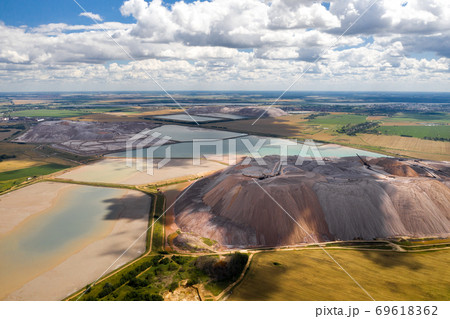 Mountains of products for the production of potash salt and artificial reservoirs.Salt mountains near the city of Soligorsk.Production of fertilizers for the Land. Belarus. 69618362