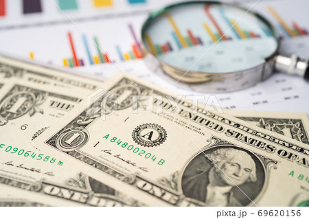 US dollar banknotes money on graph paper. US dollar banknotes money on graph paper. 69620156