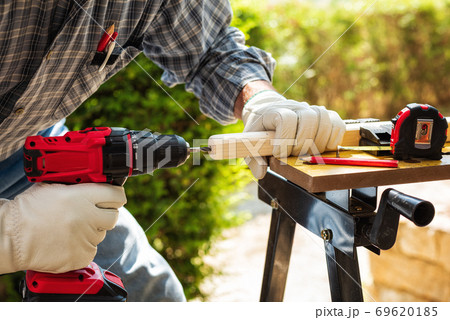 Carpenter at work on wooden boards. Carpentry. Carpenter at work on wooden boards. Carpentry. 69620185