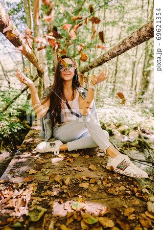 woman relax in autumn forest woman relax in autumn forest 69621354