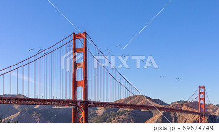 View of famous Golden Gate Bridge in San Francisco in the rays of the setting sun 69624749