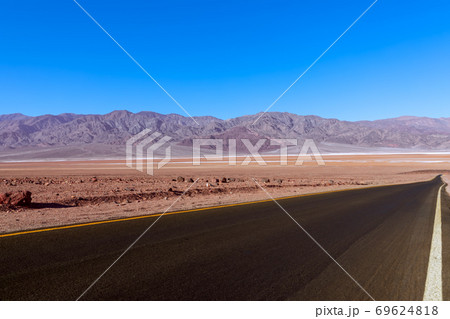 View of highway (Artists Dr.) crossing Death Valley National Park. California. USA 69624818