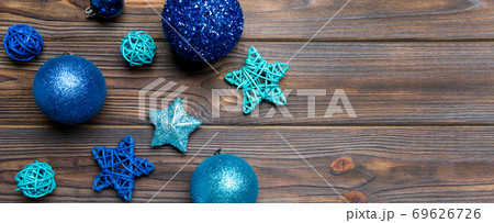 Top view Banner of festive winter composition on wooden background with empty space for your design. Christmas baubles and decorations. New Year concept 69626726
