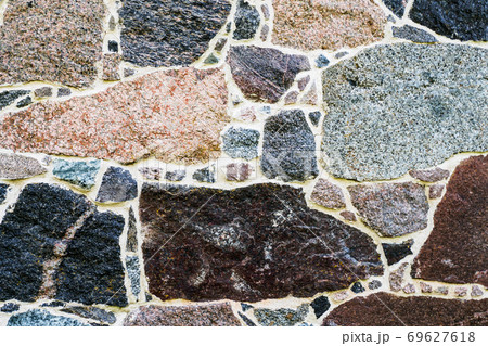 Stone Wall as a Background, Banner, Backdrop, Wallpaper, Poster, or Decorative Design. The Texture of a Stone Wall 69627618