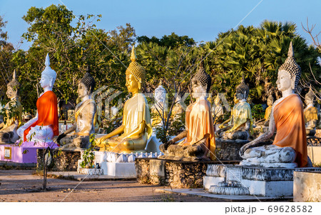 A colorful group of Buddha statues at the Buddhist Cemetery. 69628582
