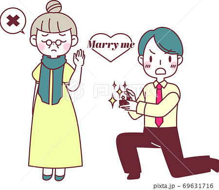 指輪を出してプロポーズをするカップル 69631716