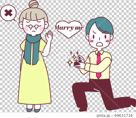 指輪を出してプロポーズをするカップル 69631716