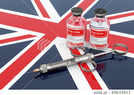 Vaccination in the United Kingdom concept. Vaccine bottles with syringe on the British flag, 3D rendering 69639821