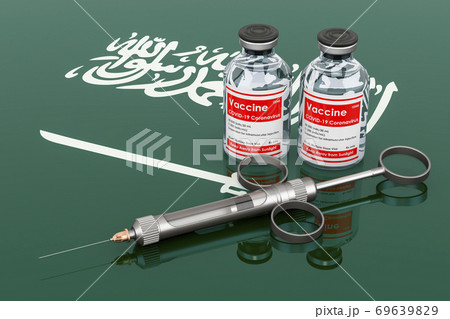 Vaccination in Saudi Arabia concept. Vaccine bottles with syringe on the Saudi Arabian flag, 3D rendering 69639829