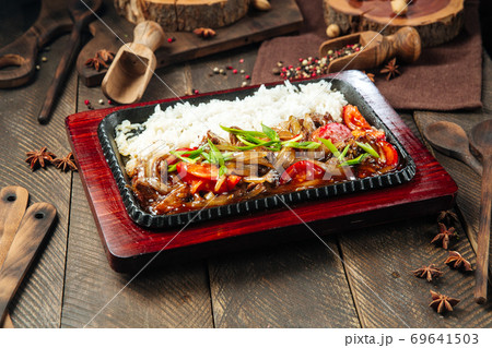 Beef with vegetables and rice in cast iron pan Beef with vegetables and rice in cast iron pan 69641503