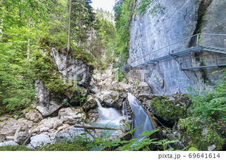 The shwangau waterfalls and the Neuschwanstein The shwangau waterfalls and the Neuschwanstein 69641614
