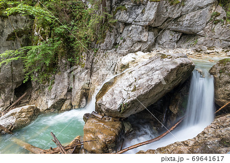 The shwangau waterfalls and the Neuschwanstein The shwangau waterfalls and the Neuschwanstein 69641617