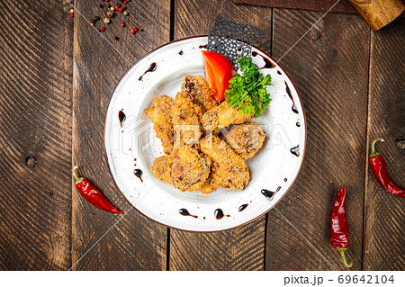 Deep fried chicken appetizer on the wooden table 69642104