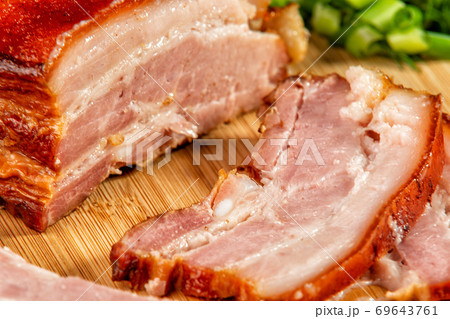 smoked meat cut into slices lies on a wooden table smoked meat cut into slices lies on a wooden table 69643761