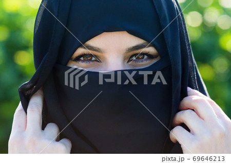 Islamic woman in national dress, close-up. Islamic woman in national dress, close-up. 69646213