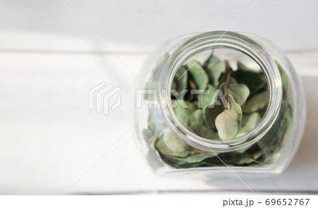 Healing herbs in glass bottle. Alternative medicine concept, Healing herbs in glass bottle. Alternative medicine concept, 69652767